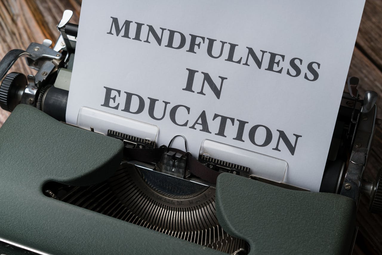 Close-up of a vintage typewriter with Mindfulness in Education paper.